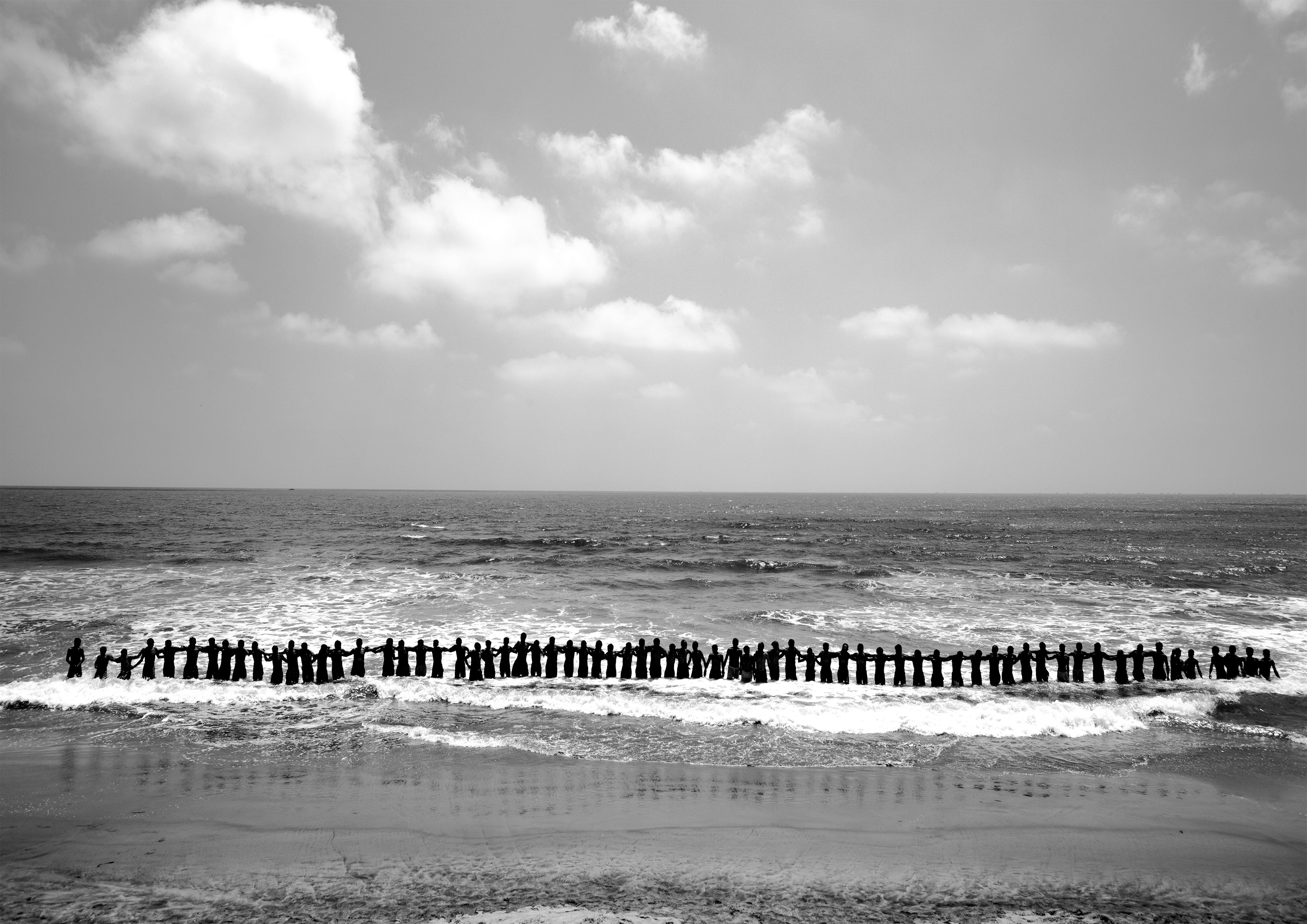 Fishermen lining up holding hands